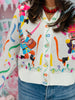 Queen Of Sparkles Multi Drummin Nutcracker Button Up Feather Sleeve Cardigan (Reg. & Plus)